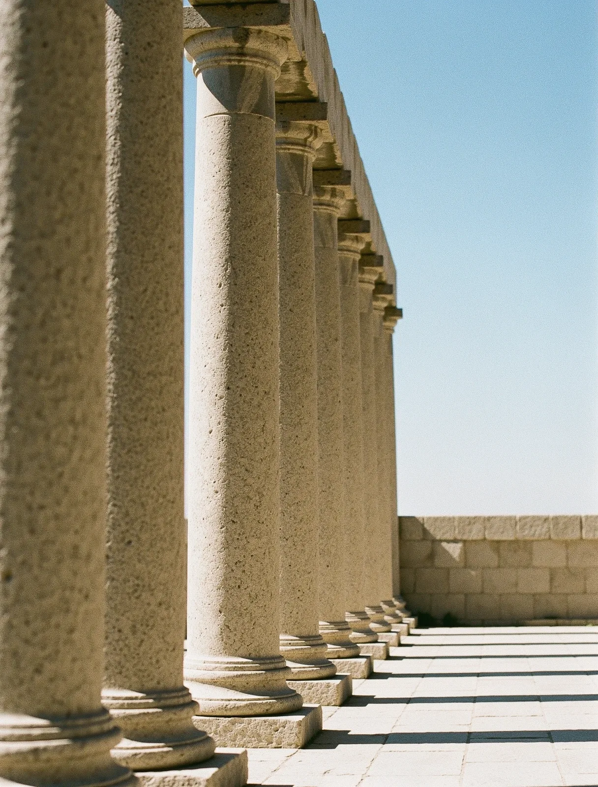 Architectural stone pillars representing stability and discipline